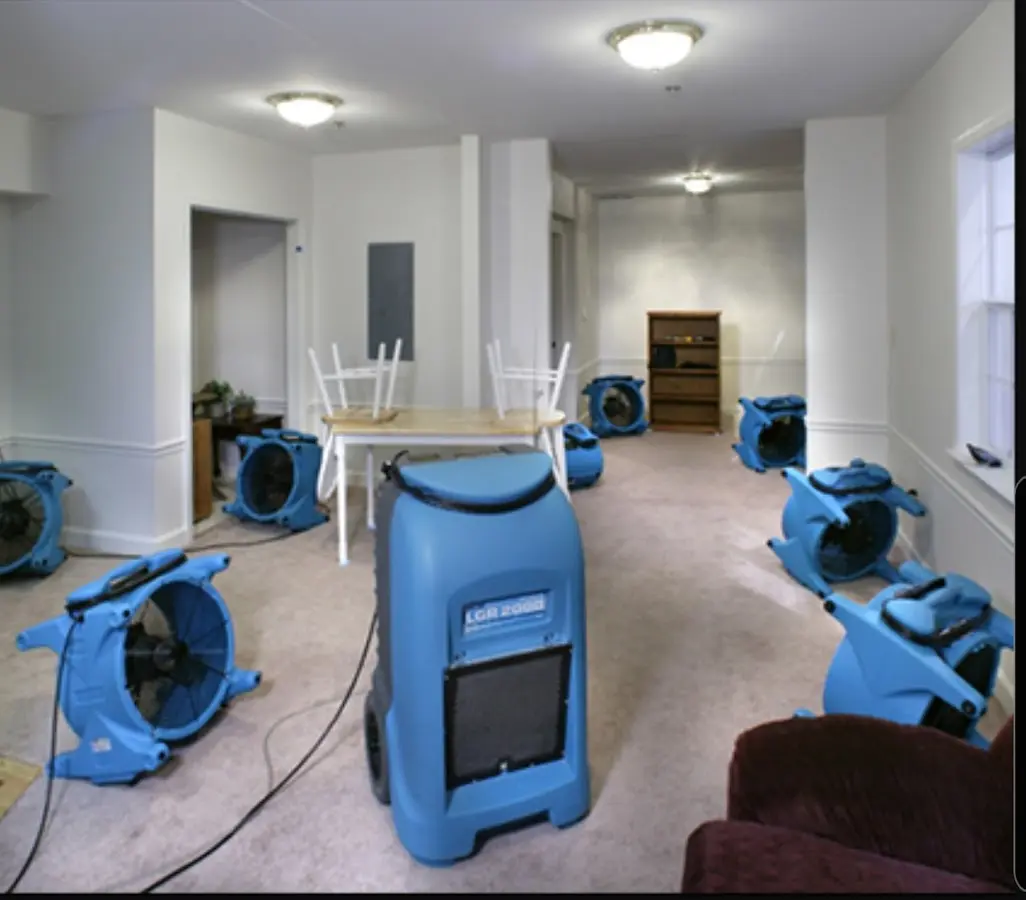 Air movers and dehumidifier setup for Water Damage Restoration in Kensington